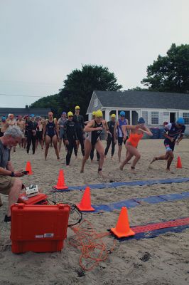 Mattapoisett Lions Club Triathlon
Emily Tato was grateful to Aner Larreategi after their top-three-overall performances in Sunday’s Mattapoisett Lions Club Triathlon. Pushed from start to finish by Larreategi, Tato was the fastest woman in all three events, the swim, bike and run. Don Cuddy was the 70-and-over winner. Photos by Mick Colageo
