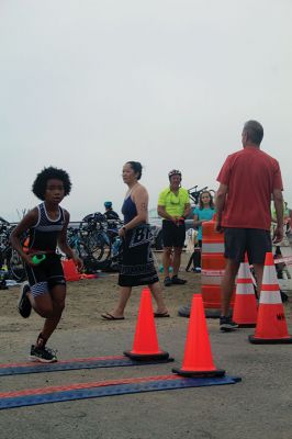 Mattapoisett Lions Club Triathlon
Emily Tato was grateful to Aner Larreategi after their top-three-overall performances in Sunday’s Mattapoisett Lions Club Triathlon. Pushed from start to finish by Larreategi, Tato was the fastest woman in all three events, the swim, bike and run. Don Cuddy was the 70-and-over winner. Photos by Mick Colageo
