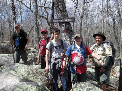 Marion Troop 32
Marion Troop 32 at the Southwest Marker of Camp Yawgoog in Rockville, RI at the Connecticut boarder. From Left to right is Chris Horton, Zachary Pateakos, Jack Nakashian, Jackson St. Don and Scoutmaster Paul St. Don. Camp Yawgoog is a 1,800-acre reservation for Scouting operated by the Narragansett Council of the Boy Scouts of America (BSA). Founded in 1916, Yawgoog is the fourth oldest continuously run Scout camp in the United States. Photo Courtesy Robert H. Nakashian
