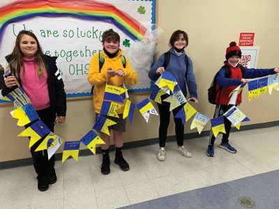 Ukrainian Support
Old Hammondtown School fifth-graders Fiona Payne, Wyatt Churchill, Jacqueline Cobler, and William Lucy hold a banner they helped to make. After hearing the story of her friend's evacuation from Ukraine, teacher Amy Casi invited the students to make banners of hope and support for Ukrainian children. Mrs. Casi's friend, a fellow teacher of fifth-graders at Kyiv International School, left Ukraine during voluntary evacuations and is currently staying in Texas with her family. 
