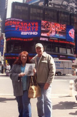 Times Square
Pat & Linda Rosa Denise with the 1st Edition of The Wanderer dated July 24, 1992 (with the Wanderer on the cover!) Linda is the daughter of Donald & Paula Rosa, and granddaughter of the late Manuel (Bud) & Hazel Roza of Mattapoisett. Pat & Linda were married in the Shipyard Park Gazebo March 21, 2008 and are pictured in Times Square, NYC, March 28, 2008 (April 16, 2009 edition)

