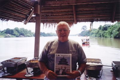 Bridge on the River Quai
Wandering Wanderer Dr. Charles A. Tavares holds a copy of The Wanderer on the way to the Bridge on the River Quai during a recent trip to Thailand. Photo courtesy of Dr. Tavares.

