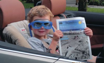 Visit with the Grandparents
Three-year-old Tyler Francis was on his way to dinner with his grandfather Gary Wynn and he took a copy of The Wanderer with him. Tyler lives in Raynham, but visits his grandparents often at Harbor Beach. Photo courtesy of Gary Wynn.
