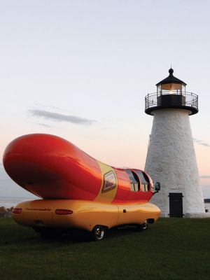Wienermobile at Ned's Point
Those enjoying the afternoon at Ned’s Point Lighthouse on Sunday, August 17 did a double take when they suddenly saw a sight they were not expecting to see — a giant wiener on wheels parked alongside the Ned’s Point lighthouse. It was not just any wiener on wheels — it was the famous Oscar Mayer Wienermobile, on location taking some promotional photographs from Mattapoisett’s most iconic setting. Photo by Denise Mello
