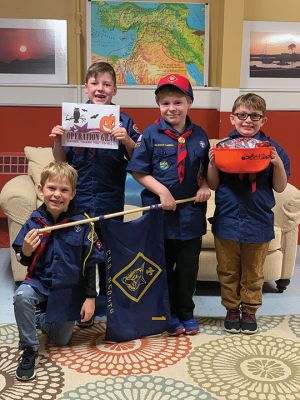 Wolf Scouts of Mattapoisett Pack 53
As part of earning their Council Fire badge, the Wolf Scouts of Mattapoisett Pack 53 participated in a community service project by donating their leftover Halloween candy to Operation Gratitude. The candy gets shipped in care packages to first responders and people actively serving in our military. Pictured from L-R: Dominic Philie, Willem Haley, Sean Carvallho. George Victoria (kneeling). Photo courtesy Rob Haley, Wolf Den Leader
