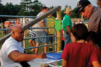 Rochester Wrestling
Hall of Fame wrestler Tony Atlas (left) made an appearance at the Rochester County Fair’s annual wrestling match.  Atlas, popular in the 1970s and 1980s, was a professional body builder, and most notably, beat Hulk Hogan in 1981 at Madison Square Garden.  Photo by Eric Tripoli. 
