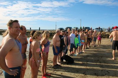 Christmas Day Plunge
At 94, Bob Humphrey was the elder statesman participating in the Christmas Day plunge held at Mattapoisett Town Beach, which including 47 swimmers and raised $2,595 in donations for the benefit of Helping Hands & Hooves. While December 25 was unseasonably mild, the water temperature in the harbor was still chilly as the effort inspired camaraderie among participating friends and couples. Photos by Mick Colageo
