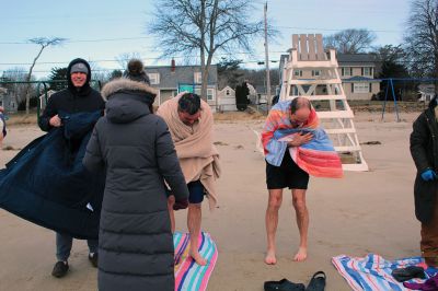 Christmas Plunge
An ice-cold Christmas morning in Mattapoisett did not stop citizens from jumping all the way into the waters of Mattapoisett Town Beach in support of Helping Hands and Hooves. Photos by Mick Colageo
