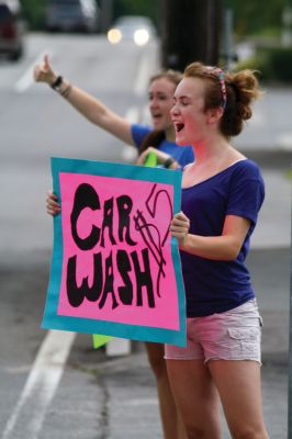 Car Wash!
The Lady Bulldogs took to the street on July 9, 2011, washing cars at the Mattapoisett Fire Department to raise funds for Old Rochester Regional Girls� Basketball team uniforms and supplies. Photo by Anne Kakley.
