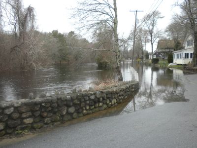 River Road Flood
The heavy rains over the past week finally pushed the Mattapoisett River beyond it's banks causing the road to be closed and flooding near by yards. March 31, 2010.  Photo by Paul Lopes
