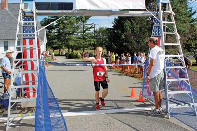Rochester Road Race
Andy Sukeforth of Middleboro was first across the finish line at the 8th Annual Rochester Road Race with a time of 16:01. Photo by Nick Walecka.
