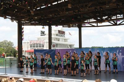 Showstoppers at Disney
The Showstoppers – the Tri-Town’s community-service singing troupe – performed at the Waterside Stage in Downtown Disney World to a packed crowd and standing ovation on Aug. 8. The members, who range in age from 6 to 19, also participated in a Disney Performing Arts Workshop. Photo courtesy Kelly Zucco.
