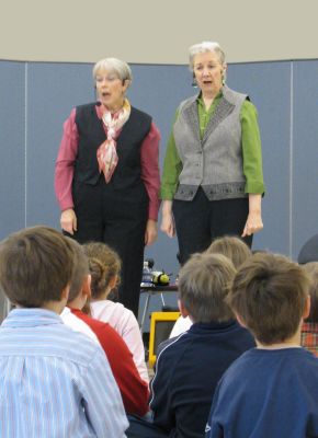 Storytellers
On Thursday, March 11, storytellers Anne-Marie Forer and Cindy Killavey, the dynamic duo that makes up Take Two Tandem Tellers, performed for Center Schools first graders. Their storytelling program incorporated song and Anne-Marie Forer accompanied with fiddle and guitar. The children and teachers enjoyed this fun, interactive experience. Photo courtesy of Debra Nettles.
