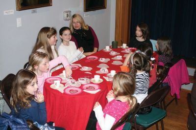 Valentine Tea
The Marion Art Center hosted an American Girl themed Valentine Tea Party on February 6, 2010. Over 20 girls dressed in their pink and red finest enjoyed dainty finger foods, festive cupcakes, red fruit punch, and tea. Morgan Middleton played Kirsten and Phoebe Mock played Singing Bird in the Marion Art Center American Girl mini-musical that accompanied the tea party. Photo by Anne OBrien-Kakley.
