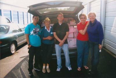 For the Troops
On the far right, Mattapoisett resident Alicia Sullivan meets with volunteers in Newport, RI, last week, to send over 160 boxes of food and necessities to American troops stationed in Afghanistan. The goods were collected from municipal and business locations all over the Tri-Town. Photo courtesy of Alicia Sullivan.
