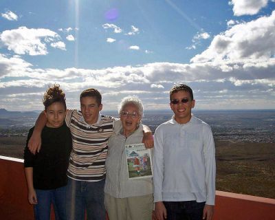 Texas Tour
Lifelong Mattapoisett resident Blanche Perry poses with grandchildren Meghan, Chris and Raymond Sottak, on the overlook at Franklin Mountain State Park with a copy of The Wanderer during her recent visit to Fort Bliss in El Paso, Texas. (Photo courtesy of Tracey Sottak).
