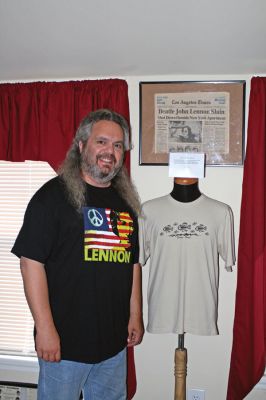 Beatlemania in Mattapoisett
Jim Cushman of Mattapoisett, an avid Beatles collector, poses alongside a shirt worn by the late John Lennon during the recording of his final album Double Fantasy. Cushman obtained the shirt from Richard Carlson, a guitar tech at the Hit Factory in New York where the sessions were recorded, who received the shirt as a gift from Lennon himself. Its just one of countless Beatles-related collectibles Cushman has amassed over the years. (Photo by Kenneth J. Souza).
