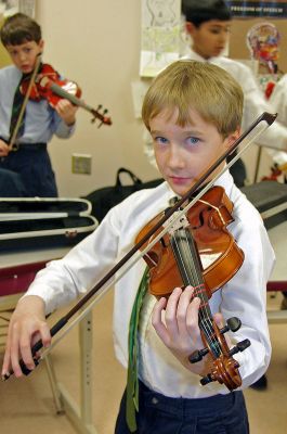 Old Hammondtown Orchestra
Violinist Everett Coulter, a fifth grader at Old Hammondtown School in Mattapoisett and a member of the newly-formed Old Hammondtown School Orchestra, practices before a recent concert. The Old Hammondtown School Orchestra combines 25 members of the schools concert band and 25 strings players and will head to the Massachusetts Instrumental and Choral Conductors Association (MICCA) conference next spring. (Photo by and courtesy of Laura McLean).
