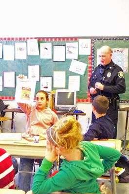 DARE Returns
Rochester Patrolman and DARE Officer Kevin Flynn instructs one of four sixth grade classes at Rochester Memorial School about the dangers and health risks associated with smoking cigarettes. Officer Flynn and Rochester Police Chief Paul Magee recently pushed to revive the DARE Program at the towns elementary school, despite cutbacks in state aid. The ten-week DARE Program attempts to educate students about the potential dangers of alcohol, tobacco and drug use. (Photo by Kenneth J. Souza).
