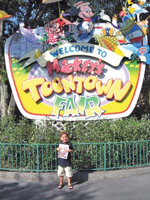 Touring 'Toon Town
Jason Gracia poses with a copy of The Wanderer at Disneytoon Town during a vacation this past May. (Photo by Dee Perry). (06/26/08 issue)
