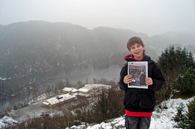 Far Away in Norway
Eleven-year-old Haakon W. Perkins poses with The Wanderer in a town outside of Bergen, Norway where he attended the Heglandsdalen Skule (seen below in background) from July through December 2006. (1/11/07 issue)
