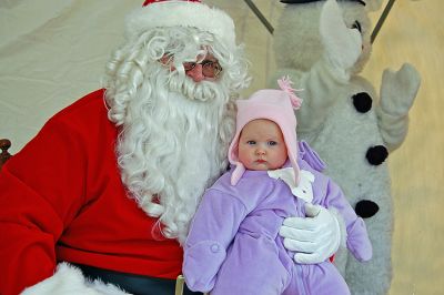 Santa, Baby
Santa poses with Caitlin Collier, daughter of Jeremy and Sarah Collier of Mattapoisett, during the photo-taking session at Mattapoisetts Holiday in the Park. (Photo courtesy of Rebecca McCullough).
