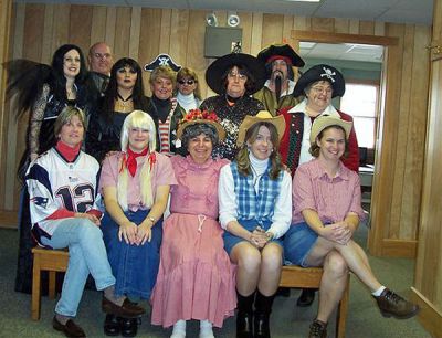 Town Hall-oween
The staff at the Mattapoisett Town Hall decked out in their Halloween costumes posed for this photo on All Hallows Eve, October 31. See if you can spot the familiar faces behind the make-up and masks in this picture, provided courtesy of Assistant to the Town Administrator Melody Pacheco.
