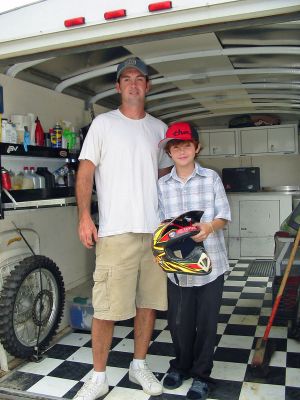 Rochester Racer Excels
Ten-year old Rochester resident Patrick DeLowery poses with his proud father, Joed. Patrick has won over 50 motocross races in the New England region over the past five years and will participate in the prestigious AMA/Air Nautiques Amateur National Motocross Championships at Loretta Lynns Tennessee ranch next month. (Photo by Nancy MacKenzie).
