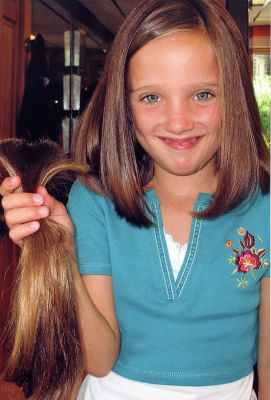 Locks of Love
While getting a back to school haircut, Camryn McNamara of Mattapoisett recently donated over 13 inches of hair to the charity Locks of Love. The organization provides wigs to children suffering from Alopecia or long-term hair loss due to illness. Camryn is a second grader at Center School in Mattpoisett and hopes some of her classmates might think about doing the same. It made me feel very happy to give someone my hair who doesnt have any, she said.
