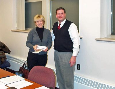 Educator Honored
The Old Rochester Regional District School Committee recently honored Donna Perry at the December school committee meeting for her initiation of the ORR Dance Team and the Every 15 Minutes program at Old Rochester Regional High School. Ms. Perry, pictured here with ORR School Committee Chairman Robert Nectow, is a resident of Mattapoisett who is in her second year with ORR. (Photo courtesy of Danielle Brightman).
