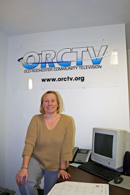Tri-Town TV
Kim Miot, the newly-hired Executive Director of Old Rochester Communty Television, Inc. (ORCTV), poses inside ORCTVs new office and studio space inside the Captain Hadley House complex on the corner of Front Street and Route 6 in Marion. (Photo by Robert Chiarito).

