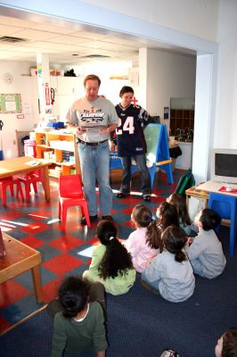 Reading Aloud
On Friday, January 25, Stephen Lynch, whose daughter Sophie attends the schools Kindergarten program, took his turn reading to the children at the Kindercare Learning Center in Marion. The school was celebrating the Patriots trip to this years Super Bowl with a Patriots Day by dressing in team colors to show the spirit and support. (Photo by Robert Chiarito).
