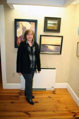 Members Show
Joan E. Andrews poses with her "Eel Pond Sunset" at the 2008 Winter Members Show at the Marion Art Center. The show features 73 pieces submitted by over 35 of the MACs members divided between the buildings two main galleries and is open now through February 28. Gallery hours are Tuesday through Friday 1:00 pm to 5:00 pm, and Saturday from 10:00 am to 2:00 pm. (Photo by Robert Chiarito).
