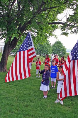 Flag Bearers
Students from Sippican School in Marion prepare to march in the town's Annual Memorial Day Parade held on Monday, May 28 in the village. (Photo by Robert Chiarito).
