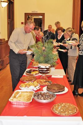 Selectmen's Greetings!
The Marion Board of Selectmen held their annual Christmas Party for Town Hall staff, boards and committees on Tuesday evening, December 2 at the Marion Music Hall. Here attendees prepare to partake in the homemade pot luck buffet. (Photo by Kenneth J. Souza).
