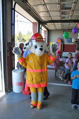 Sparky Makes the Rounds
Sparky the Fire Dog had a busy weekend recently, making the rounds to Open House events at both the Mattapoisett and Marion Fire Departments on Saturday, October 11. Here Sparky greets visitors to the Mattapoisett Fire Department on Route 6. Both departments had demonstrations and presentations on fire safety, along with fun and games for the kids. (Photo by Robert Chiarito).
