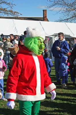 Holiday in the Park 2007
He's mean, he's green, but the Grinch had kids smiling during Mattapoisett's annual "Holiday in the Park" celebration which was held in Shipyard Park on Saturday, December 1, 2007 and drew a record crowd to the seasonal seaside event. (Photo by Robert Chiarito).
