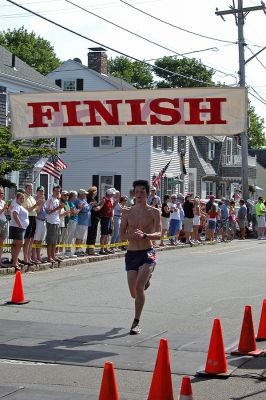 2007 Mattapoisett July 4 Road Race
Chris Darrah of Mashpee crosses the finish line in the 37th annual Mattapoisett July 4 Road Race finishing sixth overall in 29:05 with a pace of 5:49. (Photo by Kenneth J. Souza).
