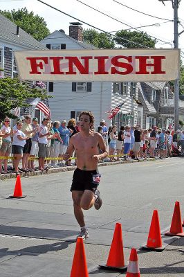 2007 Mattapoisett July 4 Road Race
Matthew Cable of Marion crosses the finish line in the 37th annual Mattapoisett July 4 Road Race finishing seventh overall in 29:14 with a pace of 5:51. (Photo by Kenneth J. Souza).

