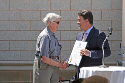 Water Works
Lifelong Mattapoisett resident Howard Tinkham accepts a citation from State Senator Mark Montigny during the dedication of the Mattapoisett River Valley Water District's Treatment Plant on Friday, May 30. Mr. Tinkham generously offered part of his family's land for the facility. (Photo by Kenneth J. Souza).
