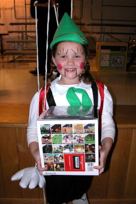 Mattapoisett Halloween '06
Asia Duff proudly displays her first place prize which she won in the Grade 3 and 4 category for her Pinocchio-like puppet costume in Mattapoisetts Annual Halloween Parade. (Photo by Kenneth J. Souza).
