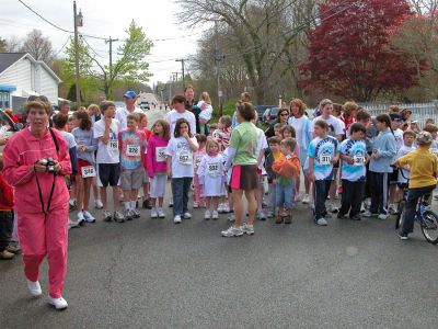 Mom's Marathon '07
An estimated 400 runners and walkers came out to the Oxford Creamery in Mattapoisett on Sunday, May 13 to participate in the first annual Tiara Classic Mothers Day 5K Road Race. The race was held to benefit the Womens Fund of Southeastern Massachusetts. Many of the runners donned tiaras and capes, making this event one of the more colorful local road races. (Photo by Robert Chiarito).

