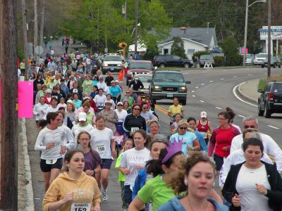 Mom's Marathon '07
An estimated 400 runners and walkers came out to the Oxford Creamery in Mattapoisett on Sunday, May 13 to participate in the first annual Tiara Classic Mothers Day 5K Road Race. The race was held to benefit the Womens Fund of Southeastern Massachusetts. Many of the runners donned tiaras and capes, making this event one of the more colorful local road races. (Photo by Robert Chiarito).
