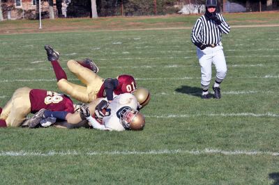 Cougar Classic
Sophomore Corey DeGrazia and senior Ryan Midwood take down one of Tri-County's players during the big "Cougar Classic" game held on November 22 at Old Colony Regional Voke which ended in a heart-breaking shutout, 21-0. (Photo by Robert Chiarito).
