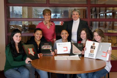 Yearbook Excellence
The Old Rochester Regional High School Yearbook Staff was recently recognized by Taylor Publishing with an Award of Excellence honoring accomplishments in Overall Yearbook Design and Coverage. Members of the ORR Yearbook Staff pictured here with some recent editions include (front, l. to r.) Jill Callahan, Editor in Chief; Courtney Rezendes; Lauren Pina; Cammie Sylvester; Bridget Murphy; (back, l. to r. ) Yearbook Advisors Ruth Jefferson and Becky Zora. (Photo courtesy of Jane McCarthy).

