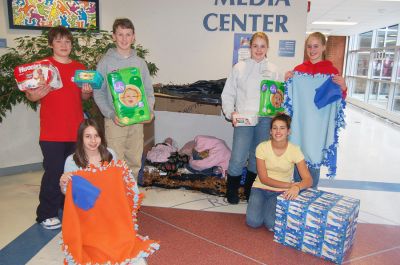 Helping the Homeless
Students in Old Rochester Regional Junior High Schools Enrichment Program have been collecting goods to help make the lives of several struggling families a bit brighter this holiday season. As a reminder of their efforts, they recently set up a makeshift homeless shelter in the junior high school lobby. Pictured here in front of the shelter are students, from left, Megan Bell, Julie Blezard, Evan Sylvia, Abby Robinson and Cayla Stafford.

