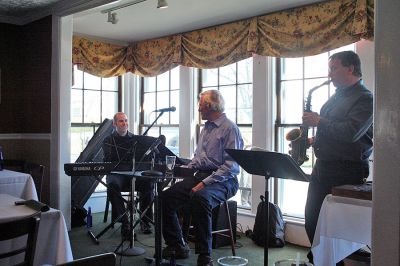 Poetic Jazz
Ellen Flynn and members of the Friends of the Mattapoisett Library welcomed poet Franklin D. Reeve to the Kinsale Inn in Mattapoisett on Sunday April 5 as part of the library's celebration of National Poetry Month. Mr. Reeve performed his piece, The Blue Cat Walks the Earth, accompianied by improvisational jazz muscians Don Davis and Joe Deleault in a performance dedicated to the memory of the late Library Director Judy Wallace. (Photo by Robert Chiarito)
