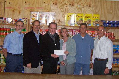 Damien's Donation
Members of the Rochester Road Race Committee recently made a donation of $3,500 from the 2007 race proceeds to The Food Pantry  Damiens Place in Wareham. Pictured here (l. to r.) are  Kevin Cassidy, Scott Muller (both of the Rochester Road Race), Father Tom McElroy (President Damiens Pantry), Patti OHare (Covanta SEMASS), Travis Van Hall, and Chuck Kantner (both of the Rochester Road Race). Not present was Road Race Committee member Jeff Perry.
