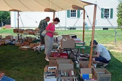 Book Bargains
Book lovers had a chance to find a good read or two as the Friends of the Joseph Plumb Memorial Library in Rochester held their annual book sale under a tent on the librarys lawn on Saturday, September 8. Bargain hunters have been flocking to this event for years in search of the perfect book and this sale was no exception with shoppers arriving bright and early to get the first crack at box upon box of reading pleasures all priced at $2 or less. (Photo by Robert Chiarito).

