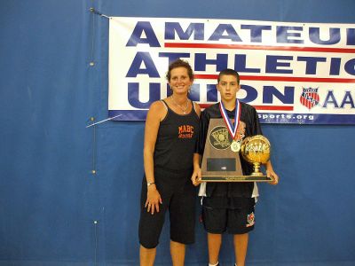 Hoop Dreams
Rochester basketball player Jarred Reuter, a member of the Championship MABC Team from Dorchester, poses with his game trophy alongside proud mom, Denise Higgins Reuter.
